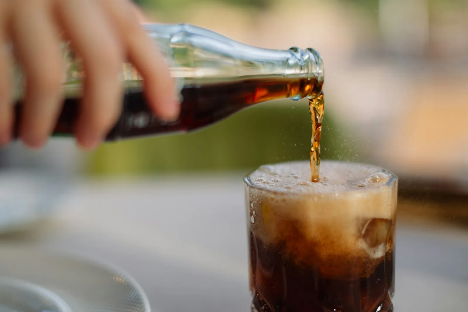 Soft drink poured over ice