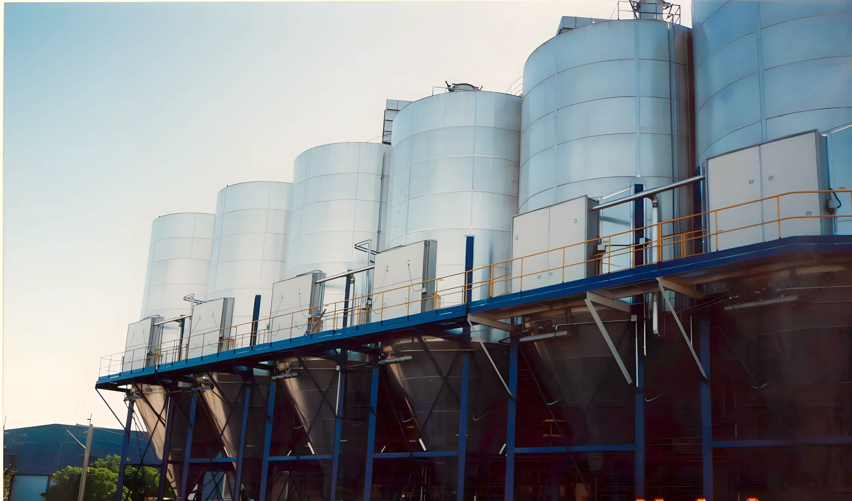 Row of TLG rigid silos on a steel gantry