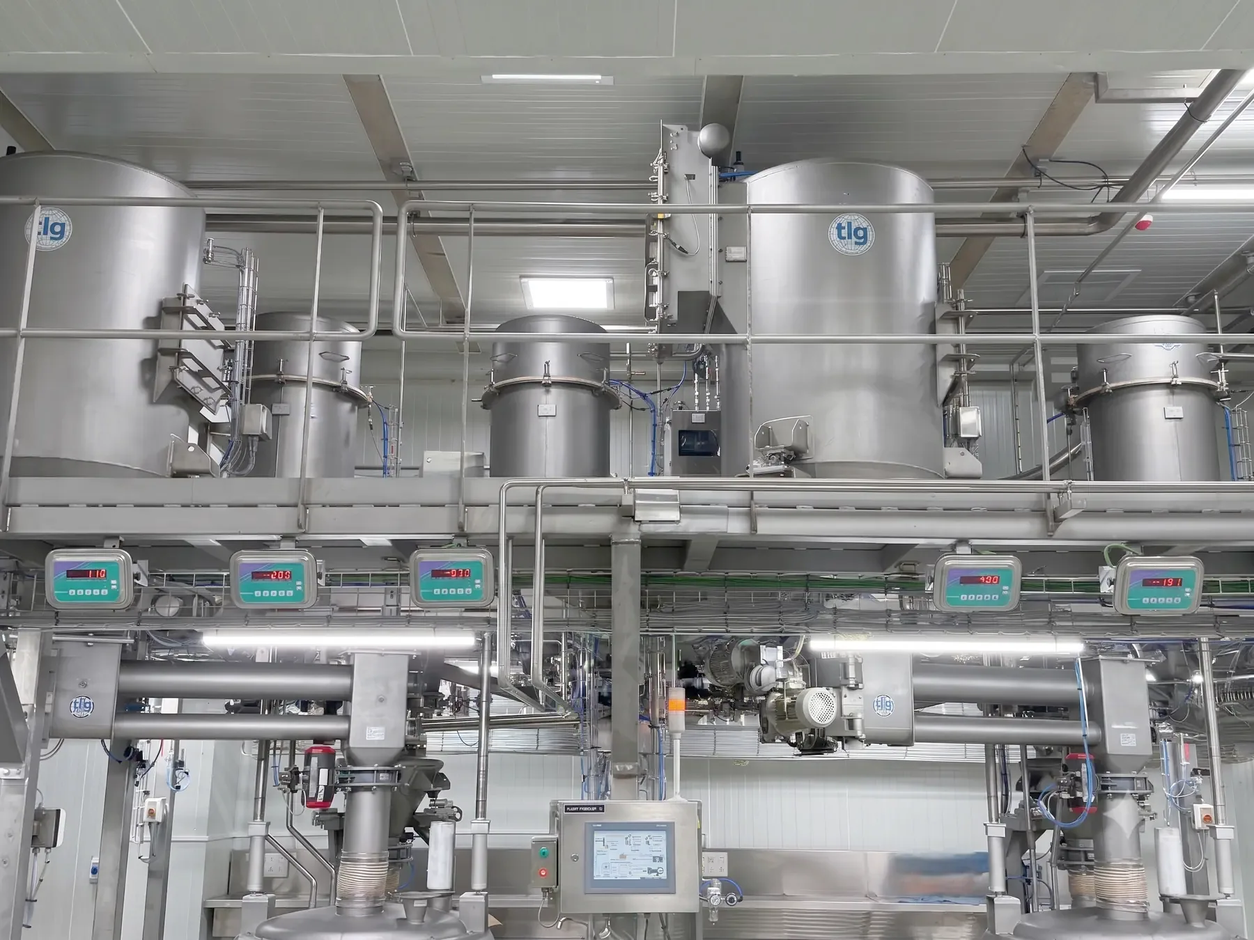 TLG receival hoppers on a mezzanine with batch weigh indicators on the deck below