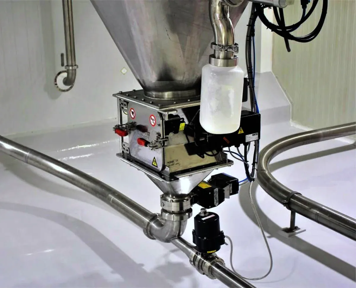 Rotary magnet installed in a TLG convey line